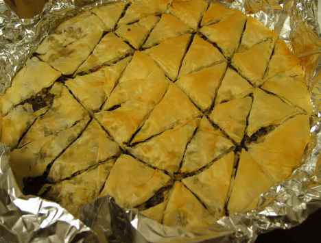 Artichoke and olive spanakopita tastes authentic even though it's completely nondairy. The party round is pretty quick to put together, too.