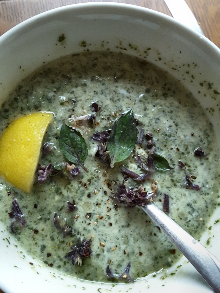 Purslane soup with purple basil garnish